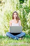 Woman On Sunny Day In Park Stock Photo