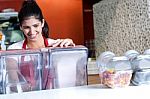 Woman Operating Machine In Cafe Stock Photo