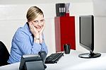 Woman Posing At Her Desk Stock Photo