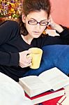 Woman Reading Book At Home Stock Photo