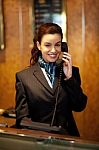 Woman Receptionist Talking Phone Stock Photo