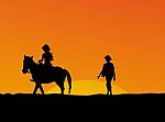 Woman Riding Horse At Sunset Stock Photo