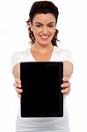 Woman Showing tablet pc Stock Photo