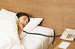 Woman Sleeping In Bed And Phone Stock Photo