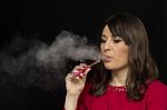 Woman Smoking A Electronic Cigarette Stock Photo