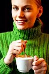 Woman Stirring Coffee Stock Photo