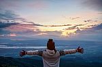 Woman Tourist Watching The Sunrise Stock Photo