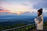 Woman Tourist Watching The Sunrise Stock Photo