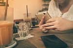 Woman Using Phone In Cafe Stock Photo