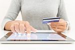 Woman Using Tablet And Credit Card Pay Shopping Online Stock Photo