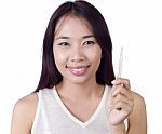 Woman Using Thermometer Stock Photo