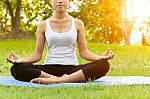 Woman Was Meditation Yoga In Park At Eveing Stock Photo