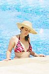 Woman Wearing Hat In Pool Stock Photo