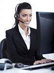 Woman Wearing Headset In Computer Room At Her Cabin Stock Photo