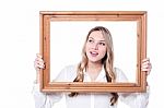 Woman With A  Wooden Photo Frame Stock Photo