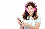 Woman With Cell Phone And Hear Phone Stock Photo