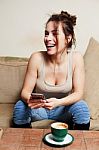 Woman With Coffee Cup On Ceramic Table And Mobile Phone Stock Photo