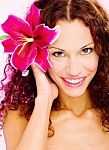 Woman With Flower In Her Curl Hair Stock Photo