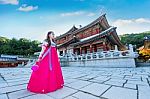 Woman With Hanbok In Gyeongbokgung,the Traditional Korean Dress Stock Photo