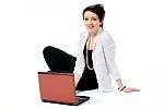 Woman With Laptop On The Floor Stock Photo