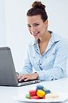 Woman With Laptop Working At Home Stock Photo