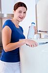 Woman With Milk Bottle Stock Photo
