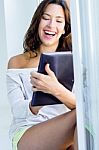 Woman With Tablet At Home Stock Photo