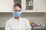 Women Doctor With Face Mask In The Office Stock Photo