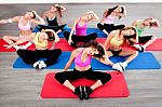 Women Doing Floor Excercise Stock Photo