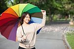 Women Holding Umbrella Stock Photo