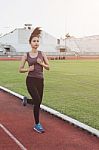 Women Runners Sprinting Outdoors. Healthy Lifestyle And Sport Co Stock Photo