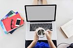 Women Sitting And Handtake Cup Of Hot Coffee Watching Media Stock Photo