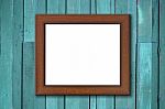 Wood Picture Frame On Green Wall Stock Photo