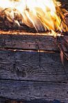 Wooden Board And Foliage On Fire Stock Photo