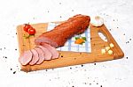 Wooden Chopping Board With Sliced Ham And Spices Stock Photo
