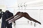 Wooden Cloth Hangers On Clothes Rail And Bathrobe Stock Photo