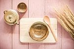 Wooden Spoon And Dish With Asian Teapot And Tea Cup On Wooden Background Stock Photo