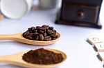 Wooden Spoons Filled With Coffee Bean And Crushed Ground Coffee Stock Photo