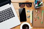 Workplace With Laptop Coffee Phone And Notebook On Wood Desk Stock Photo