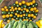 Yellow And Green Zucchini In Basket Stock Photo