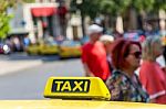 Yellow Taxi Sign On Cab Vehicle Roof Stock Photo