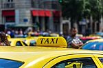 Yellow Taxi Sign On Cab Vehicle Roof Stock Photo