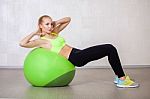 Young Active Woman Doing Pilates Exercises In Fitness Studio Stock Photo