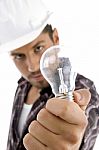 Young Architect Showing Electric Bulb Stock Photo