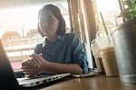 Young Asian Woman Working In Coffee Shop Stock Photo