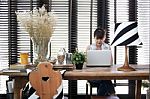 Young Asian Working Woman Is Using A Laptop With Vintage Decoration Stock Photo