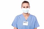Young Beautiful Doctor In Protective Mask Stock Photo