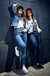 Young Beautiful Girls With Denim Suit In A Urban Background Stock Photo