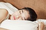Young Beautiful Woman Sleeping In Bed Stock Photo