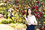 Young Beautiful Woman With Long Straight Dark Hair Posing In Spr Stock Photo